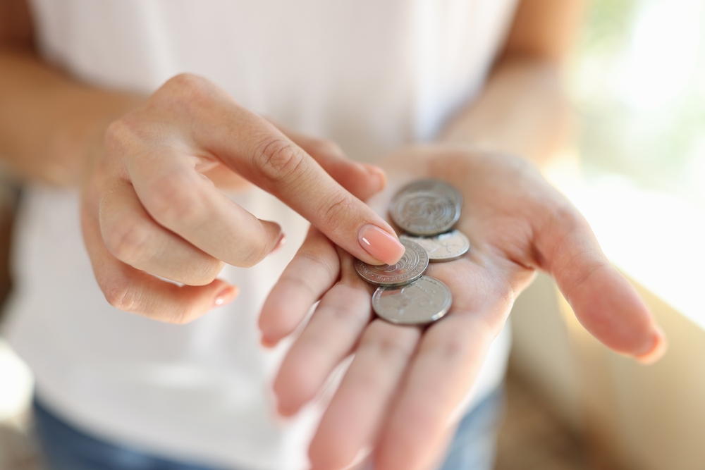 Woman,Counting,Small,Coins,In,Her,Hands,Close-up.,Cheap,Price,