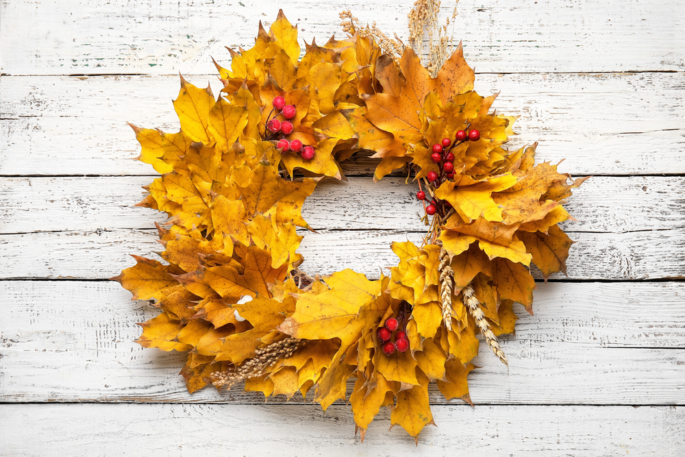 Beautiful,Autumn,Wreath,On,White,Wooden,Background