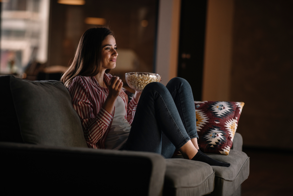 Beautiful,Woman,Watching,Movie,In,The,Night,Sitting,On,A