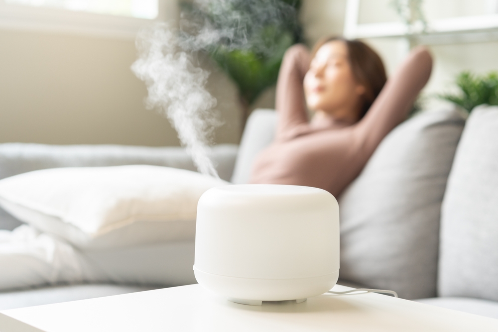 Modern,Air,Humidifier,During,Relax,Or,Rest,,Happy,Blurred,Asian