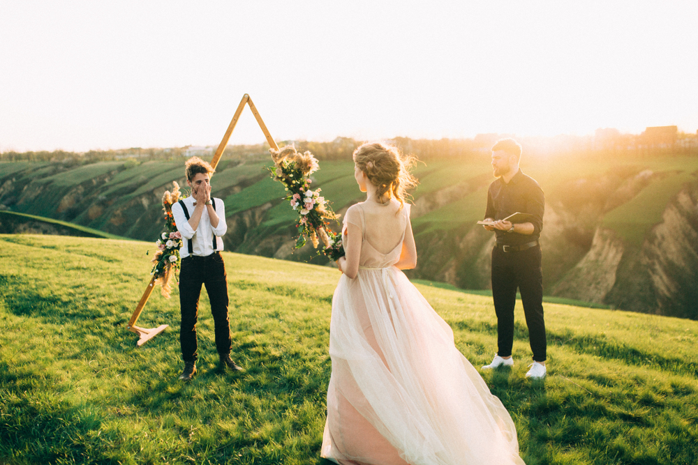 Beautiful,Bride,Walks,To,The,Happy,Groom,Near,The,Wedding